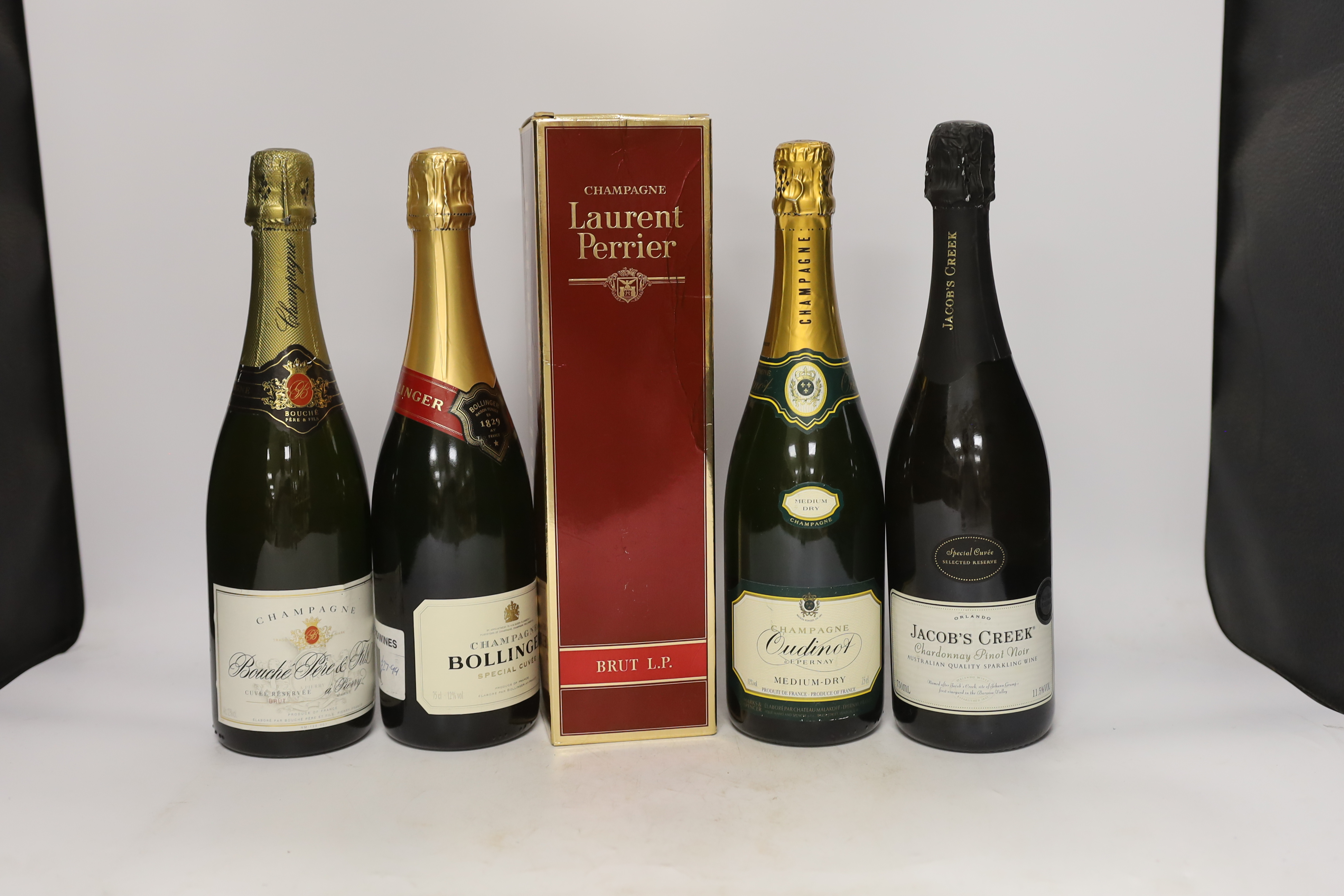 Seven various bottles of champagne, cava and sparkling wine including Laurent Perrier, Bollinger, Bouché Père & Fils etc.